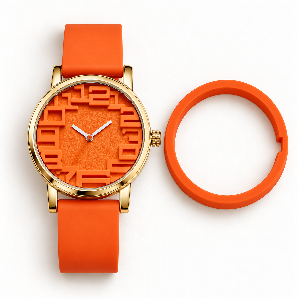 Orange KINETIC Lumo watch with the outer ring removed, showing its gold-tone case and the orange ring beside it