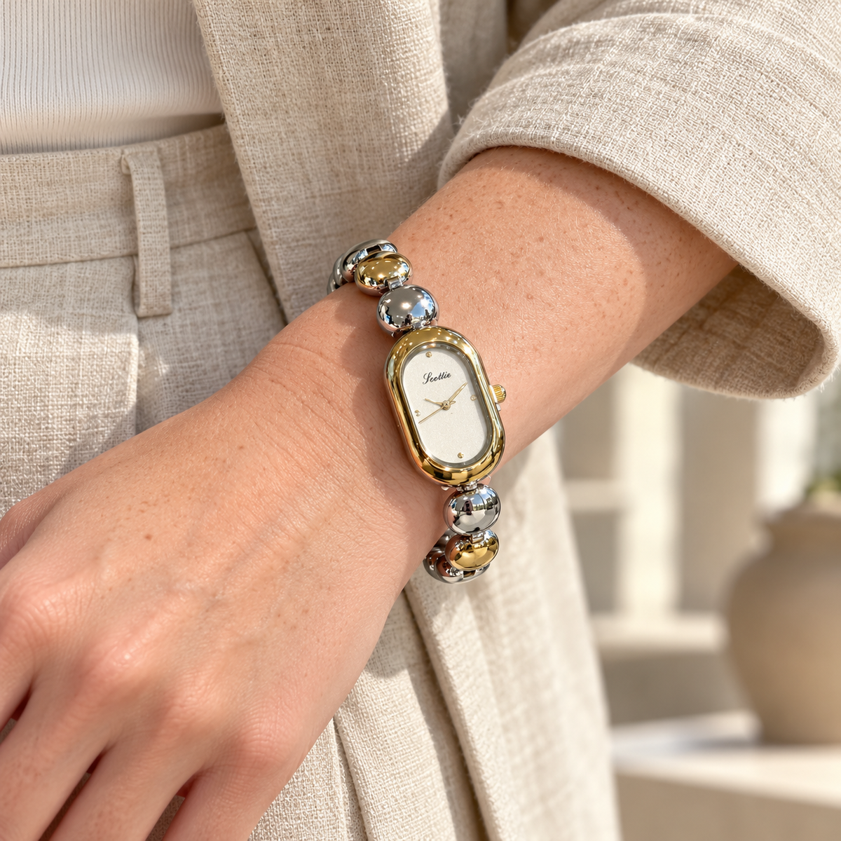 Scottie Duet watch styled with an oat linen jacket