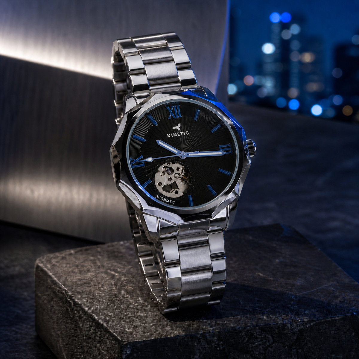 KINETIC Oceana black-dial stainless-steel watch on a blue-hour architectural plinth
