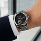 KINETIC Oceana black-dial stainless-steel watch shown beside a navy cuff