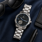 KINETIC Oceana black-dial watch in a navy editorial flat-lay