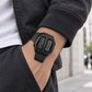 KINETIC Retro in Black worn with a charcoal jacket in the city