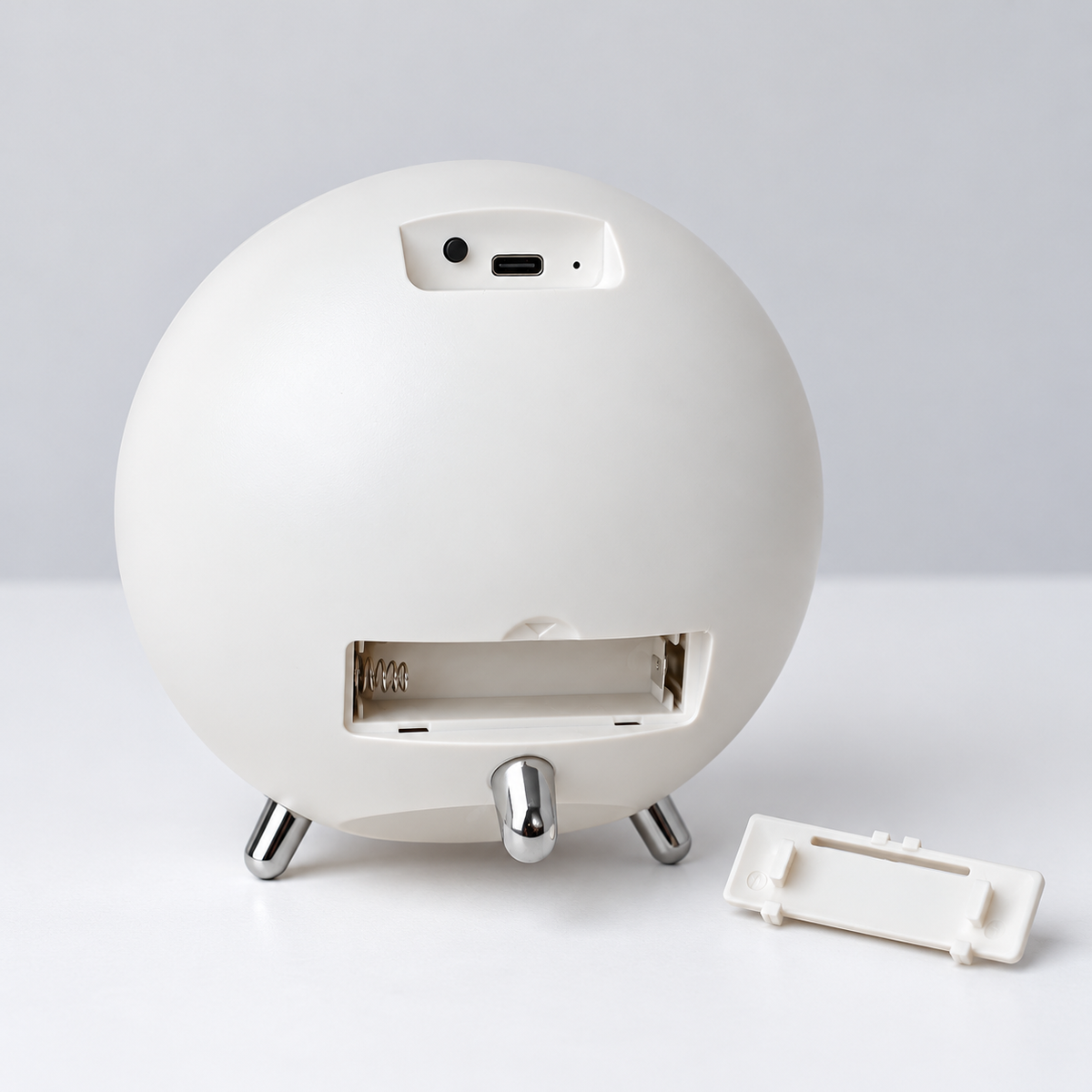 Orbit White rear USB port, button and AA battery compartment