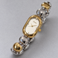 Scottie Duet’s alternating silver and gold-tone bracelet links