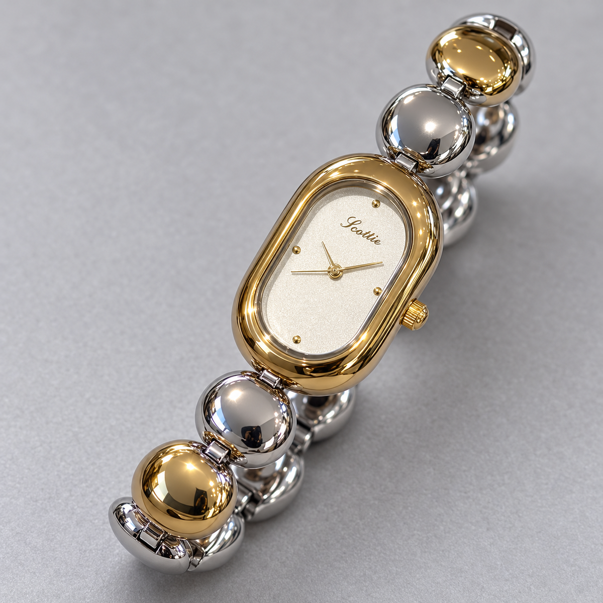 Scottie Duet’s alternating silver and gold-tone bracelet links
