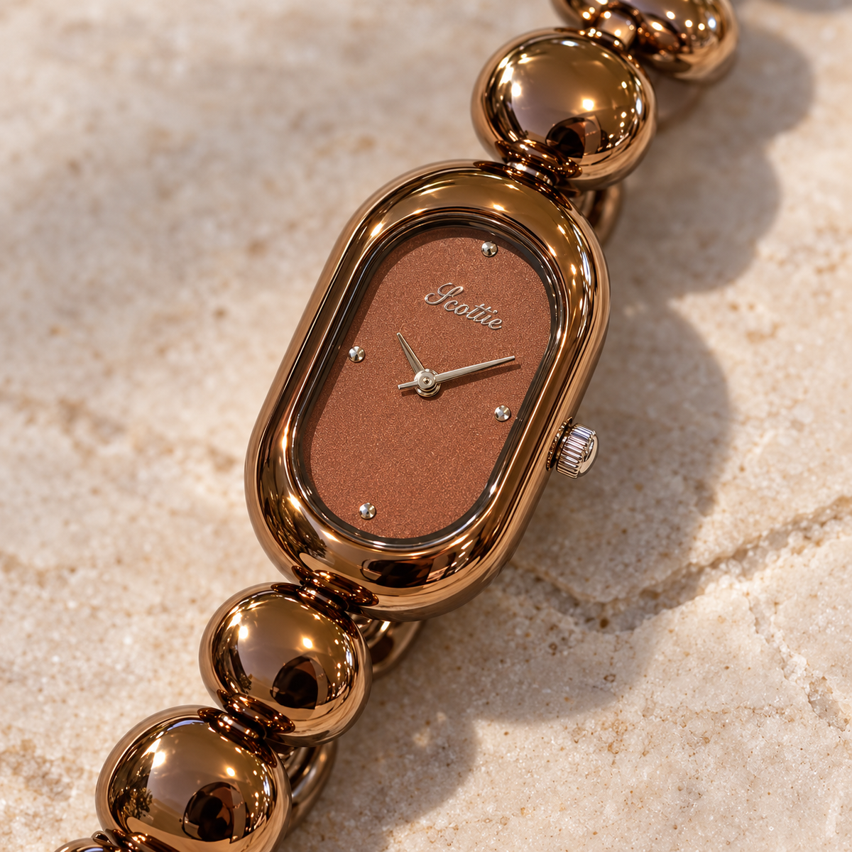 Close-up of Scottie Espresso’s brown dial and rounded case