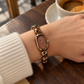 Scottie Espresso watch worn at a café beside an espresso cup