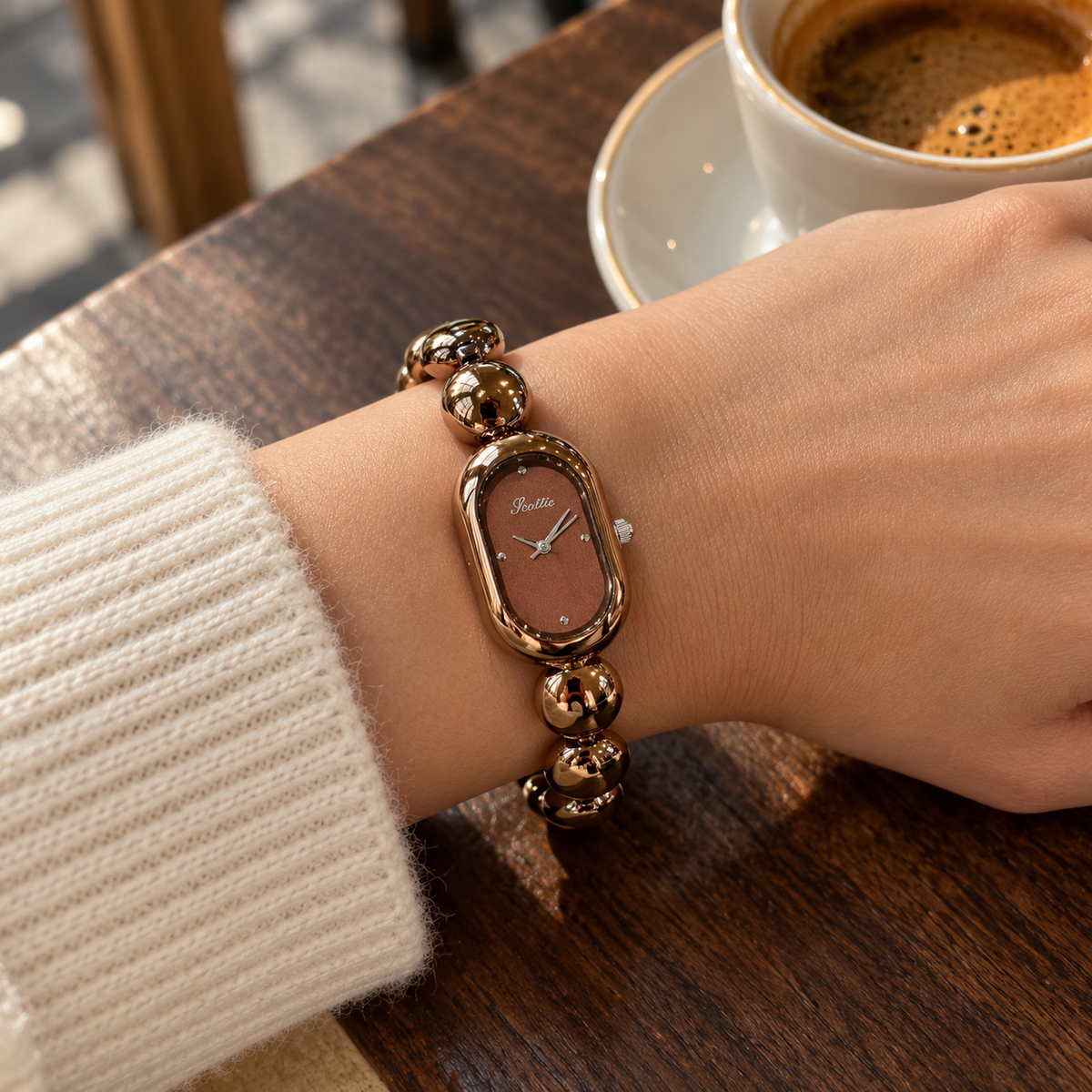 Scottie Espresso watch worn at a café beside an espresso cup