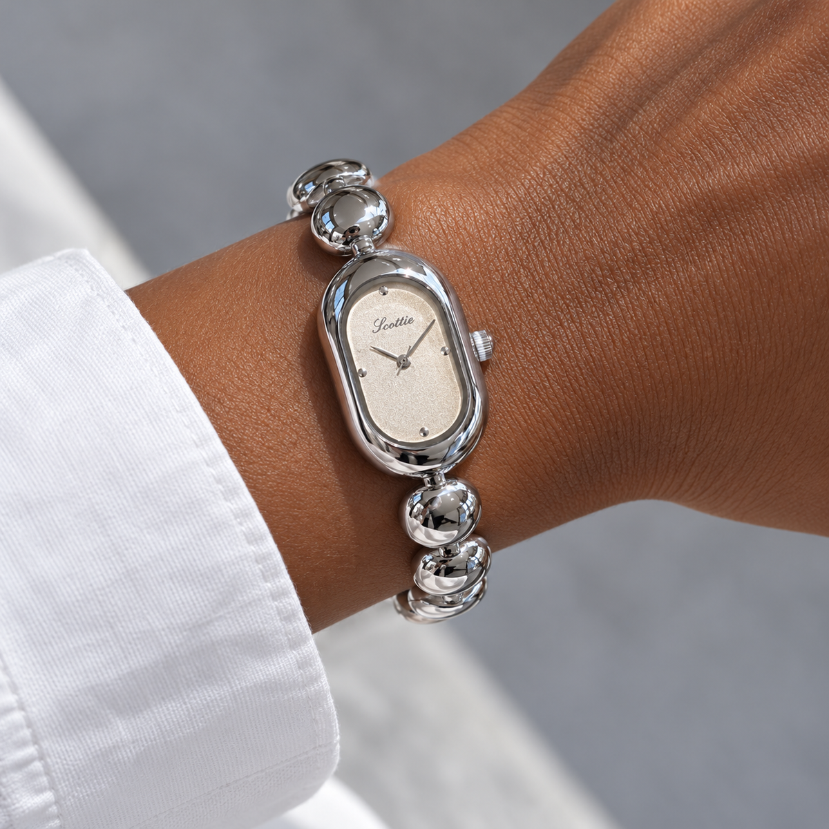 Scottie Mist watch worn beside a white cotton cuff
