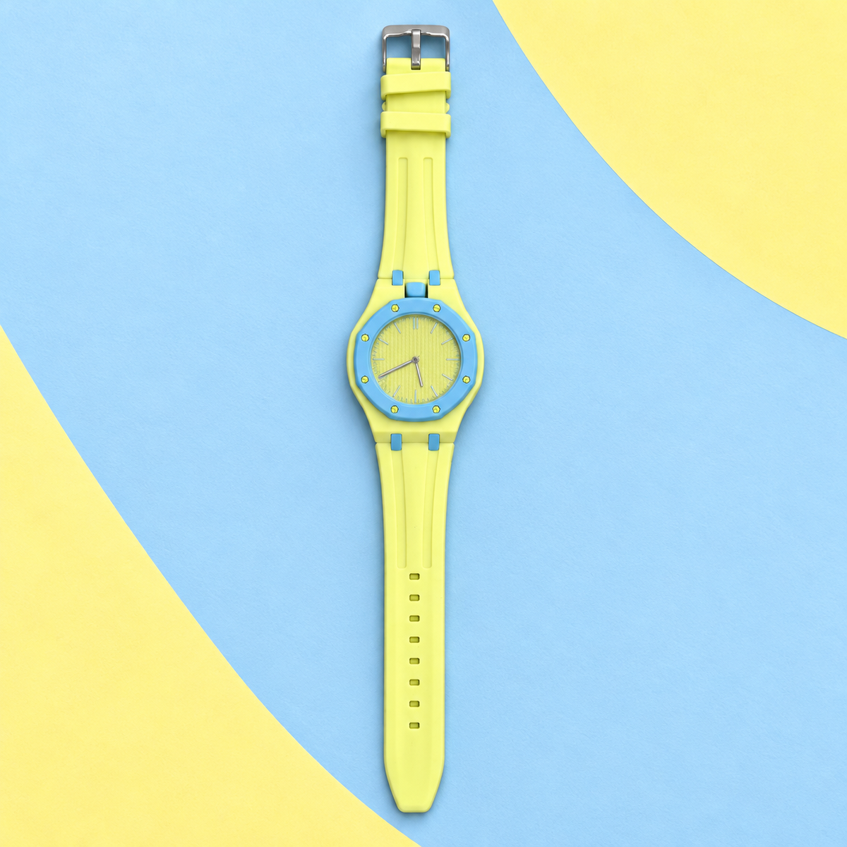 Vibe Lemon yellow watch with blue bezel on blue and yellow paper